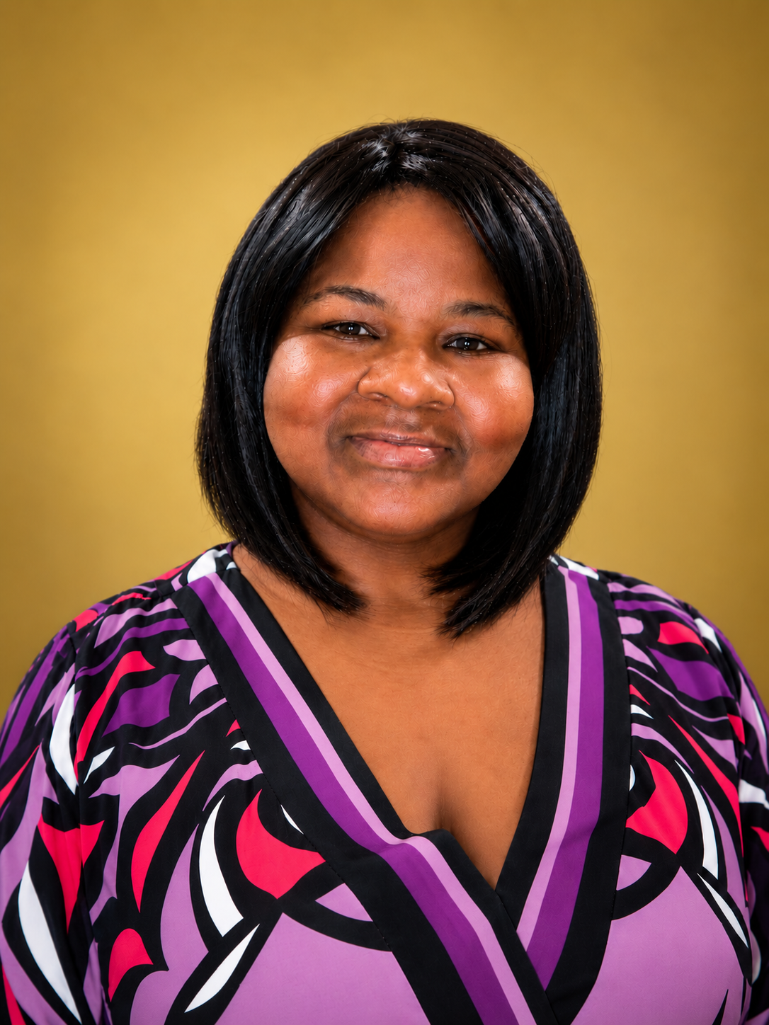 Nykki Wright, founder of Nurse to CEO, smiling against a gold background